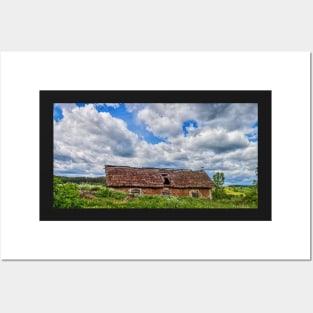 Blue cloudy sky over stork sitting on the edge of barn, Poland, Europe Posters and Art